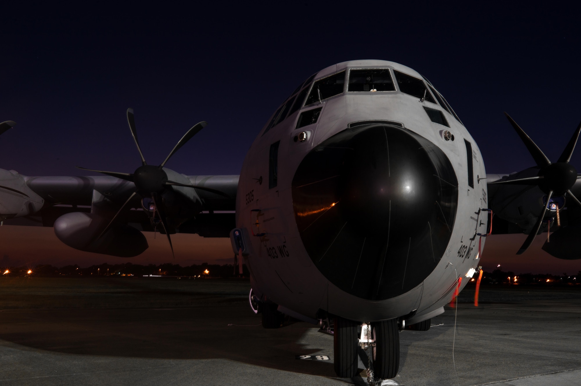 A 403rd Wing WC-130J Super Hercules aircraft is parked on the Keesler Air Force Base flight line as the sun sets. (U.S. Air Force photo/Staff Sgt. Shelton Sherrill)