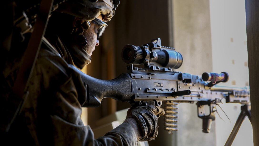 A Marine provides security from an open window during urban warfare training on Marine Corps Air Ground Combat Center Twentynine Palms, Calif., Jan. 26, 2016. Marine Corps photo by Cpl. Danielle Rodrigues