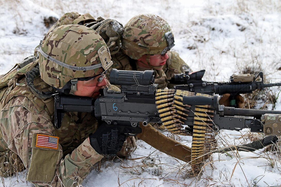 Army Spcs. Raymon Najera, left, and Ethan Mitchell provide security during a live-fire exercise in Konotop, Poland, Jan. 18, 2016. Najera and Mitchell are infantrymen assigned to the 3rd Squadron, 2nd Cavalry Regiment. Army photo by Sgt. Paige Behringer