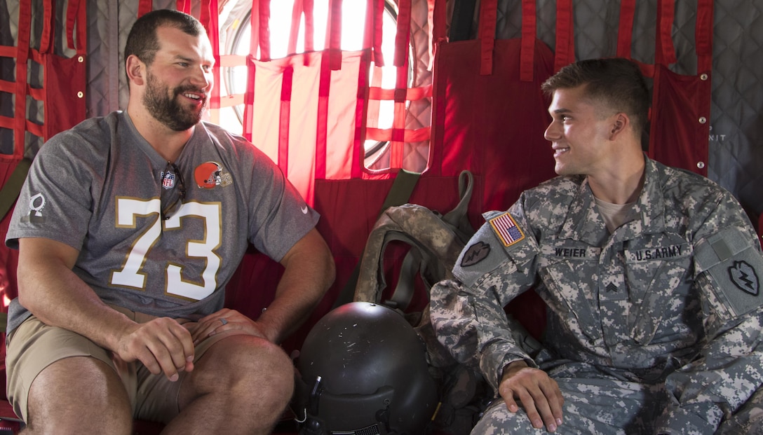 Cleveland Browns offensive tackle Joe Thomas chats with Army Sgt. Aaron Weier during the 2016 Pro Bowl Draft show on Wheeler Army Airfield, Hawaii, Jan. 27, 2016. U.S. Army photo by Sgt. Kimberly Menzies