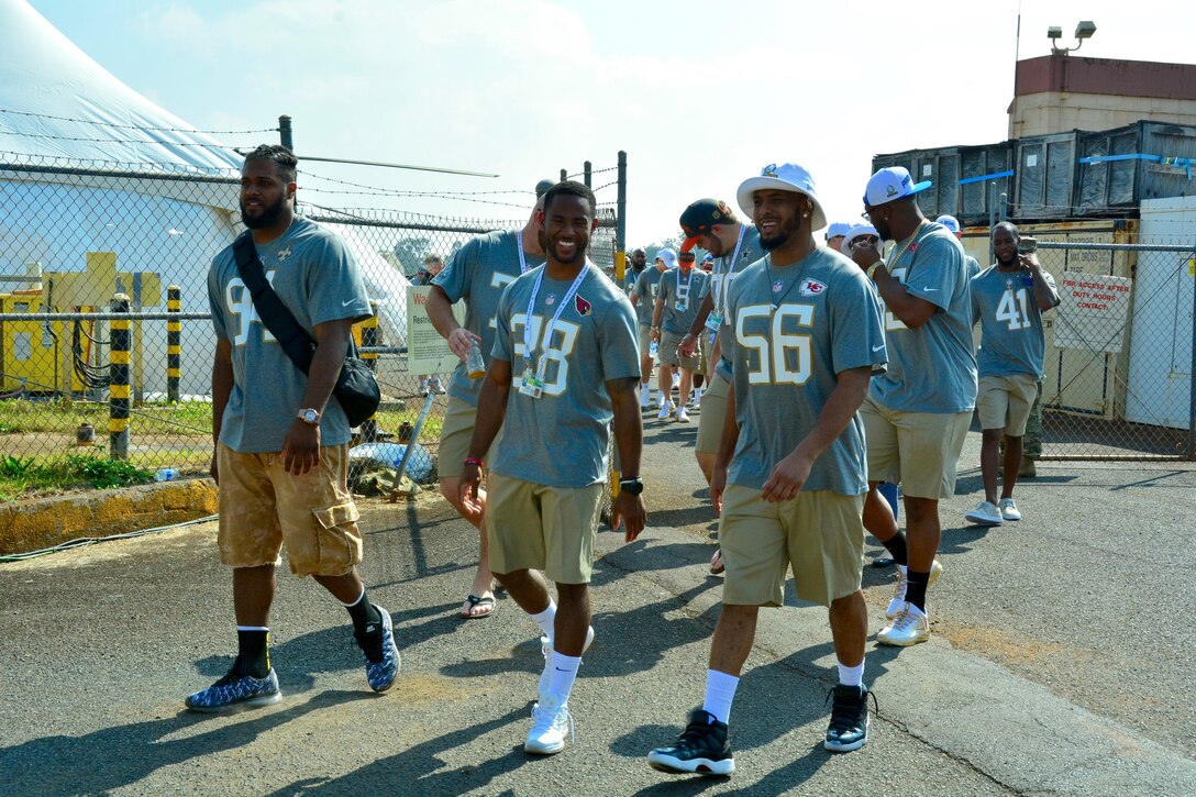 Members of the NFL's 2016 Pro Bowl teams enter the 2016 Pro Bowl Draft show on Wheeler Army Airfield, Hawaii, Jan. 27, 2016. U.S. Army photo by Sgt. 1st Class John Brown