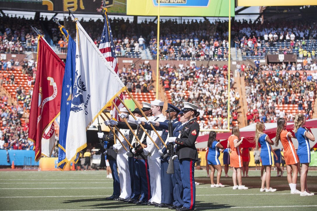 A joint honor guard prepares to render honors during the 2016 NFL Pro Bowl at Aloha Stadium in Honolulu, Jan. 31, 2016. Military volunteers built the show stage. U.S. Pacific Command leaders participated in the game’s coin toss and a C-17 Globemaster flew over the event. DoD photo by Staff Sgt. Christopher Hubenthal