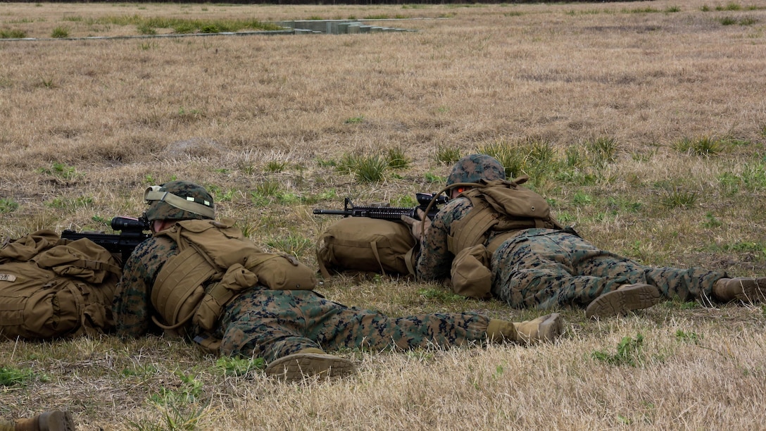 Marines with Company F, 2nd Battalion, 8th Marine Regiment, assault targets down range during a field exercise at Marine Corps Base Camp Lejeune, N.C., Jan. 28, 2016. Marines focused on individual marksmanship in preparation for a squad attack. 
