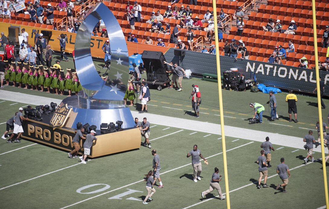 Military volunteers help set up the 2016 NFL Pro Bowl pregame show stage at Aloha Stadium in Honolulu, Jan. 31, 2016. More than 200 military volunteers worked together to construct the pregame show stage in support of Rachel Platten’s performance of her song “Fight Song.” The U.S. military also conducted a C-17 Globemaster flyover and U.S. Pacific Command leadership participated in the game’s coin toss. DoD photo by Staff Sgt. Christopher Hubenthal