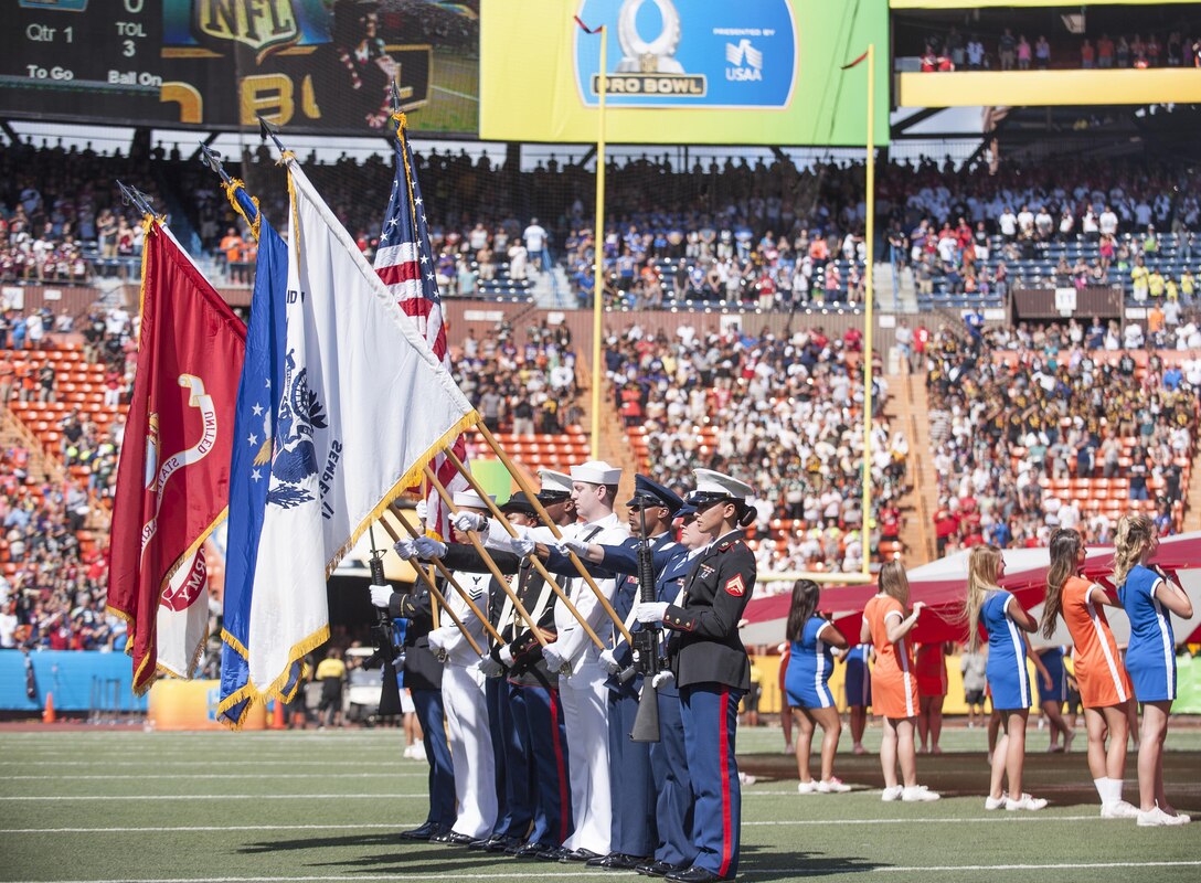 A joint honor guard detail prepares to render honors during the 2016 NFL Pro Bowl as part of the event’s pregame show at Aloha Stadium in Honolulu, Jan. 31, 2016. More than 200 military volunteers helped to construct the pregame show stage in support of Rachel Platten’s performance of her song “Fight Song.” The U.S. military also conducted a C-17 Globemaster flyover and U.S. Pacific Command leadership participated in the game’s coin toss. DoD photo by Staff Sgt. Christopher Hubenthal