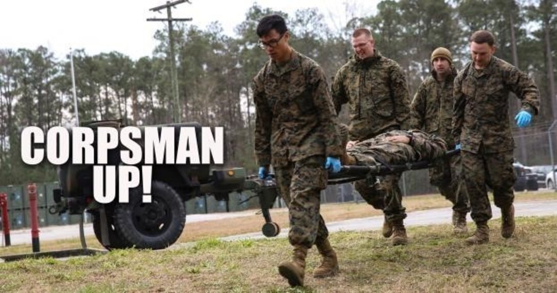 Corpsmen with 2nd Medical Battalion rush role-playing patients into a medical tent at Camp Lejeune, N.C, Jan. 28, 2016. The training is preparing a Shock Trauma Squad to treat cold related injuries for their upcoming multinational exercise, Cold Response 16.1, in Norway. (U.S. Marine Corps photo by Cpl. Michael Dye/Released)