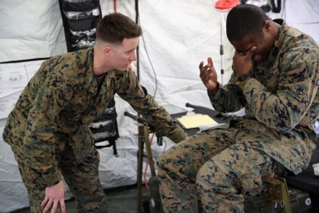 Petty Officer 3rd Class Matthew Beal, left, a corpsman with 2nd Medical Battalion, treats a role-player for injuries in preparation for the upcoming multinational exercise, Cold Response 16.1, in Norway, at Camp Lejeune, N.C, Jan. 28, 2016.  The corpsmen treated injuries mainly pertaining to the cold weather climate they will be experiencing in Norway.  (U.S. Marine Corps photo by Cpl. Michael Dye) 