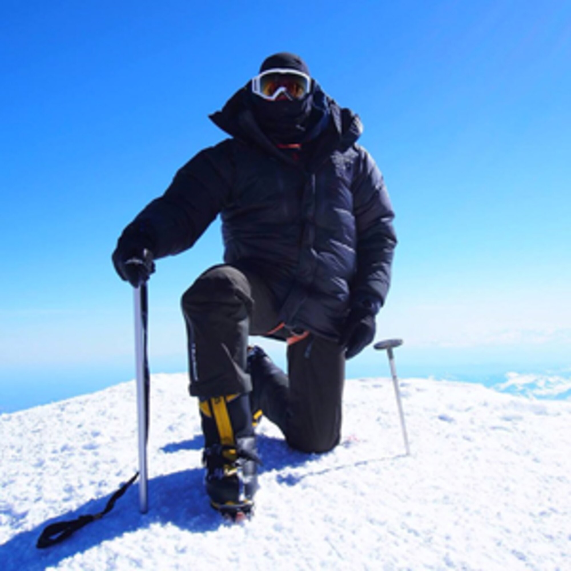 Lt. Col. Daniel Loveless, the 71st Medical Operations Squadron commander, Vance Air Force Base, Oklahoma, kneels atop the summit of Mount Denali, Alaska, June 15, 2015. Loveless is an avid mountaineer and uses the knowledge gained during his expeditions to teach about resiliency and leadership. (Courtesy photo from Lt. Col. Daniel Loveless)