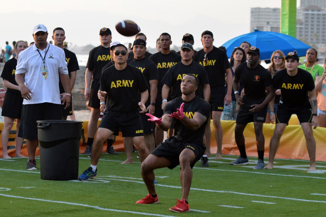 Army Sgt. Marcus Sheppard prepares to catch a football during the 2016 Pro Bowl Military Challenge at Queen's Beach in Honolulu, Jan. 29, 2016. Sheppard is an infantryman assigned to the 25th Infantry Division's 2nd Battalion, 35th Infantry Regiment, 3rd Brigade Combat Team. He won the challenge’s Fair Catch event for Team Army. Army photo by Staff Sgt. Armando R. Limon