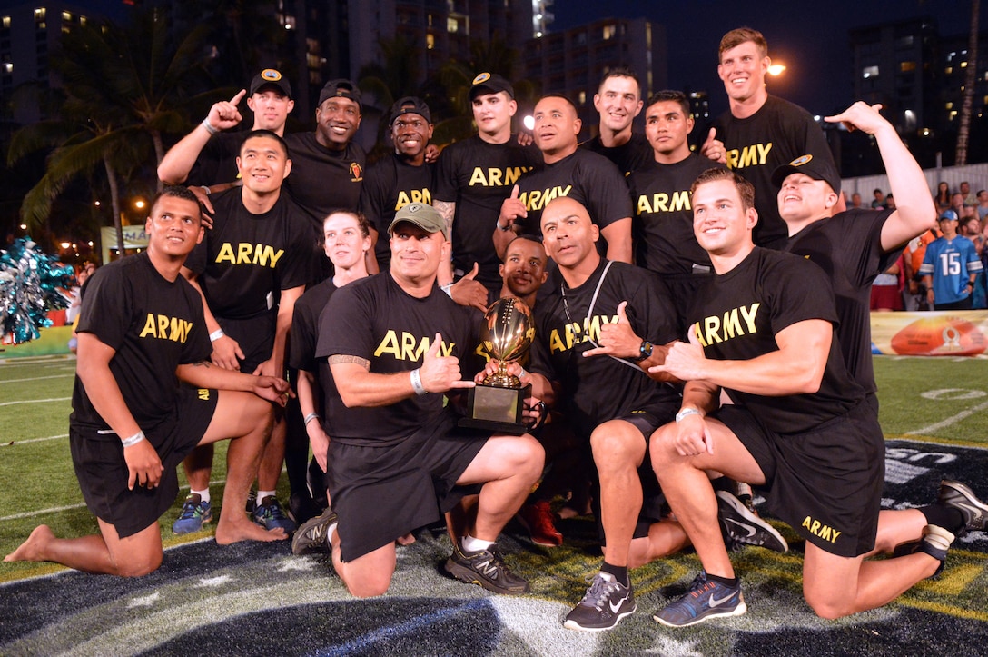 Team Army poses for a photo with the 2016 Pro Bowl Military Challenge trophy at Queen's Beach in Honolulu, Jan. 29, 2016. Army photo by Staff Sgt. Armando R. Limon
