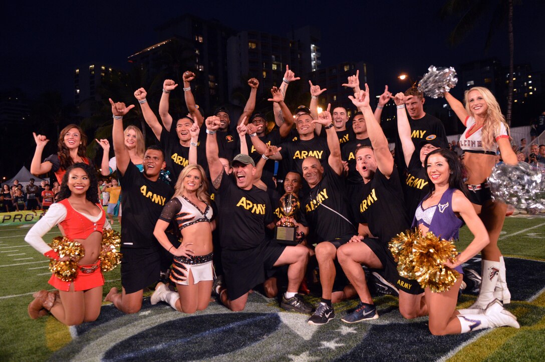 Team Army poses for a celebratory photo with the 2016 Pro Bowl Beach Military Challenge trophy at Queen's Beach in Honolulu, Jan. 29, 2016. Army photo by Staff Sgt. Armando R. Limon
