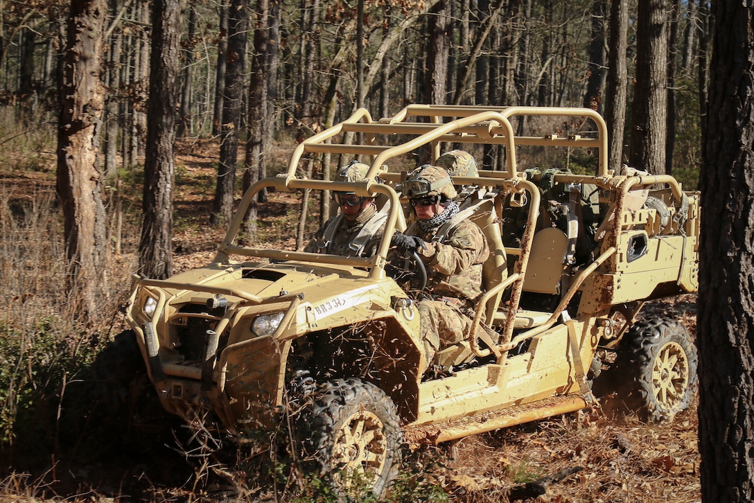 Paratroopers maneuver and weave between trees while testing the capabilities of the MRZR4 LT-All Terrain Vehicle during a familiarization course drive on Fort Bragg, N.C., Jan. 21, 2016. Army photo by Sgt. Juan F. Jimenez