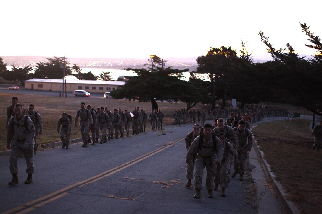 Marines from the MARDET Presidio of Monterey take part in a detachment hike at sunrise overlooking the Monterey Bay.