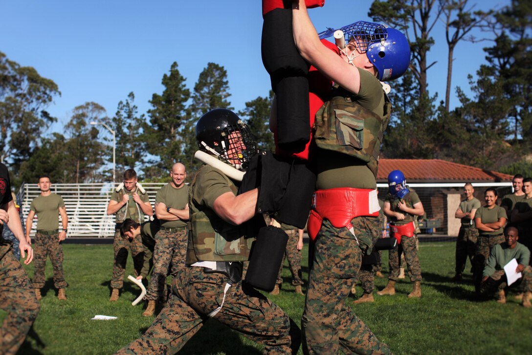 Marines from MARDET Presidio of Monterey test their martial abilities in a pugil stick bout during an inter-platoon competition on the 240th birthday of the Marine Corps.  