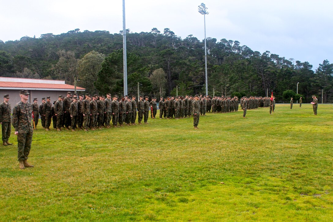 Marines from MARDET Presidio of Monterey standby in formation as they await a promotion and awards ceremony in January, 2016.