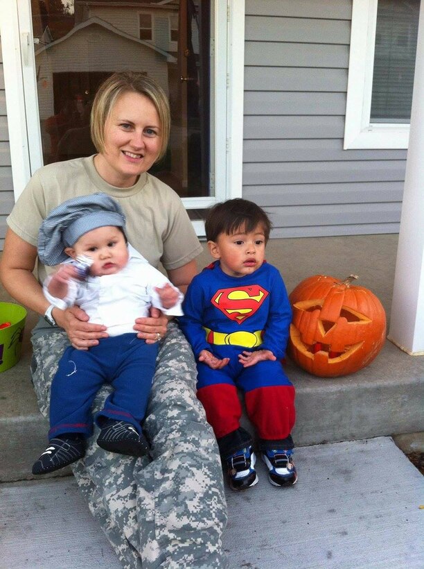 Army Capt. Eileen Hernandez, a public affairs officer with 1st Calvary Division’s 2nd Armored Brigade Combat Team at Fort Hood, Texas, awaits trick-or-treaters at home with two of her sons, Oct. 31, 2014. Hernandez said she is filled with gratitude and hope as a result of Defense Secretary Ash Carter's decision to expand maternity leave to 12 weeks. Courtesy photo by Ernesto Hernandez