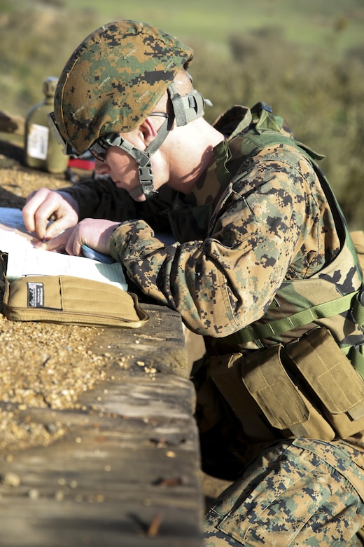 Lance Cpl. Daniel Womack, a forward observer with 6th Air Naval Gunfire Liaison Company, Force Headquarters Group, calculates target trajectory and distance to receive fire from mortars Jan. 23, 2016 at Camp Roberts, Calif. The Marines of 6th ANGLICO conducted call-for-fire exercises and machine gun ranges alongside mortar platoons from 2/23 to complete comprehensive live-fire training. 