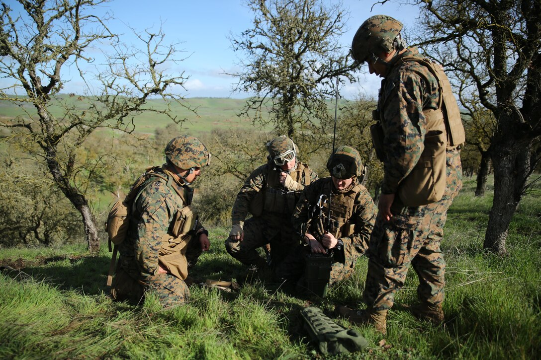 Radio operators with 6th Air Naval Gunfire Liaison Company, Force Headquarters Group, program and troubleshoot a radio during call-for-fire training Jan. 23, 2016 at Camp Roberts, Calif. The Marines of 6th ANGLICO conducted call-for-fire exercises and machine gun ranges alongside mortar platoons from 2nd Battalion, 23rd Marine Regiment, 4th Marine Division, to complete comprehensive live-fire training. 