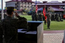 U.S. Marine Corps Col. Paul J. Nugent, commanding officer, Headquarters Battalion, 1st Marine Division, relinquishes command to Lt. Col. Michael Nakonieczny during a change of command ceremony at Marine Corps Base Camp Pendleton, Calif., Jan. 7, 2016. A change of command is a military tradition that represents a formal transfer of authority and responsibility for a unit from one commanding officer to another. (U.S. Marine Corps photo by Lance Cpl. Nathaniel Castillo, 1st Marine Division Combat Camera/Released)