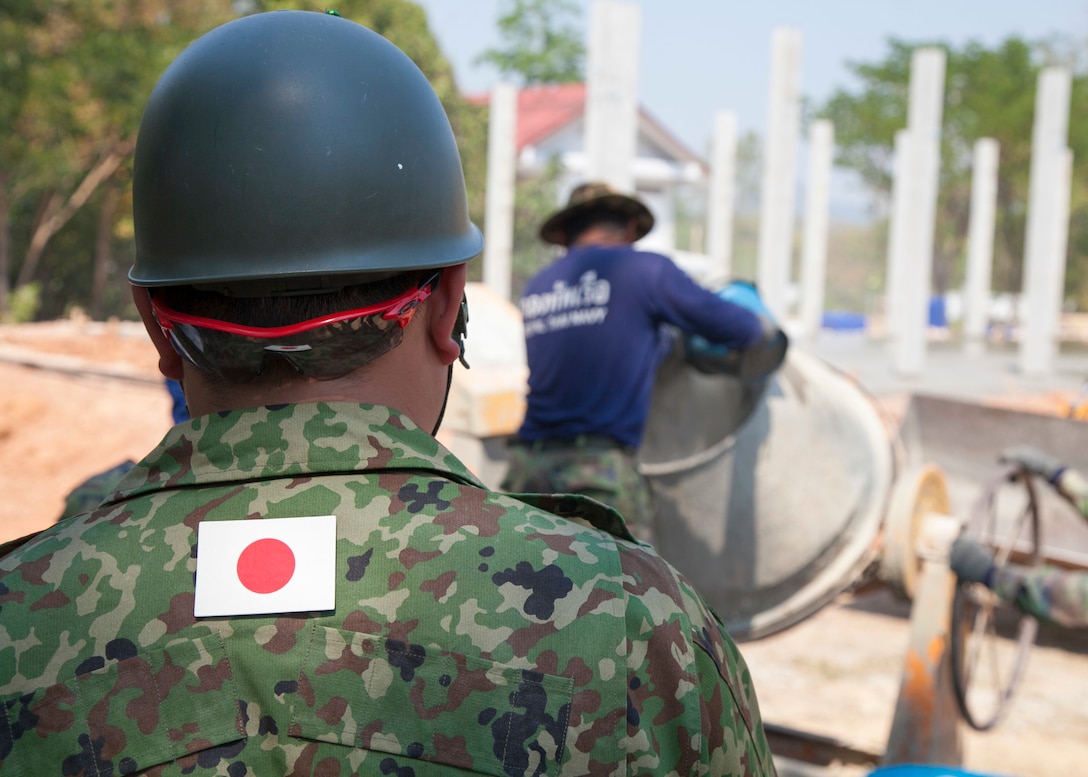 A member of the 105th Engineer Unit, Engineer Unit, North Army, Japan Ground Self-Defense Force, watches as a Royal Thai Navy sailor pours water into a cement mixing cylinder Jan. 27, at the Ban Cham Kho humanitarian civic action site, Rayong, Thailand. The construction at Ban Cham Kho is one of six HCA sites in which the Thai, U.S. and partner nation’s militaries will work together on civic programs during Cobra Gold 2016. Cobra Gold, in its 35th iteration, demonstrates the commitment of the Kingdom of Thailand and the U.S. to our long-standing alliance and regional partnership toward advancing prosperity and security in the Asia-Pacific region.