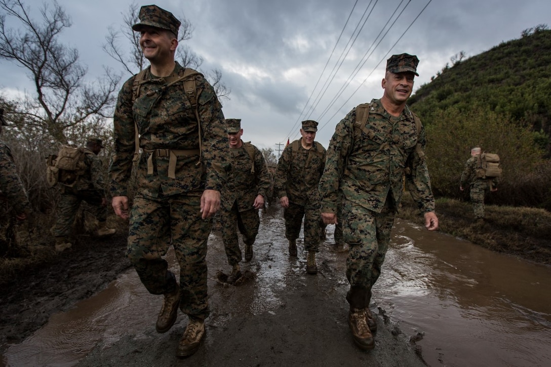 U.S. Marine Corps Maj. Gen. Daniel O'Donohue, left, commanding general, 1st Marine Division, and Col. Paul Nugent, right, commanding officer, Headquarters Battalion, 1st Marine Division, lead a conditioning hike at Marine Corps Base Camp Pendleton, Calif., Jan. 7, 2016. Headquarters Battalion conducted a conditioning hike to maintain combat and physical fitness standards. (U.S. Marine Corps Combat Camera photograph by Lance Cpl. Adrianna R. Lincoln/RELEASED)