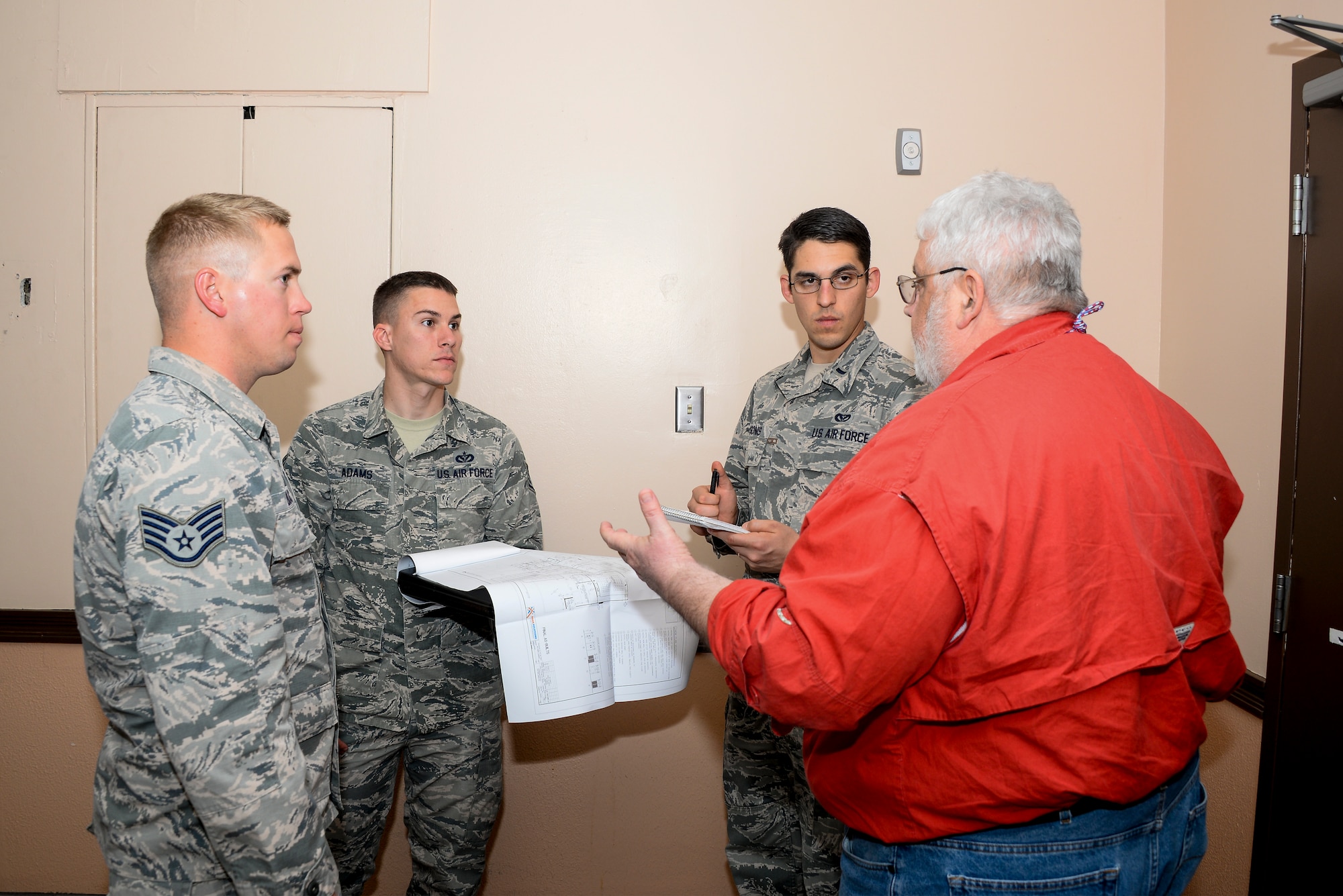 U.S. Air Force Staff Sgt. Jonathan Buck, 355th Civil Engineer Squadron pavement and equipment supervisor, Staff Sgt. Brian Adams, 355th CES heating, ventilation and air conditioning craftsman, 1st Lt. Garrett Chesonis, 355th CES chief of operations engineering, and George Newman, Air Force Civil Engineer Center Asset Visibility Team civil engineer, conduct a facility assessment at Davis-Monthan Air Force Base, Ariz., Jan. 27, 2016. AVT conducted 56 facility assessments at D-M AFB which covers approximately 1.5 million square feet. (U.S. Air Force photo by Airman 1st Class Mya M. Crosby/Released)