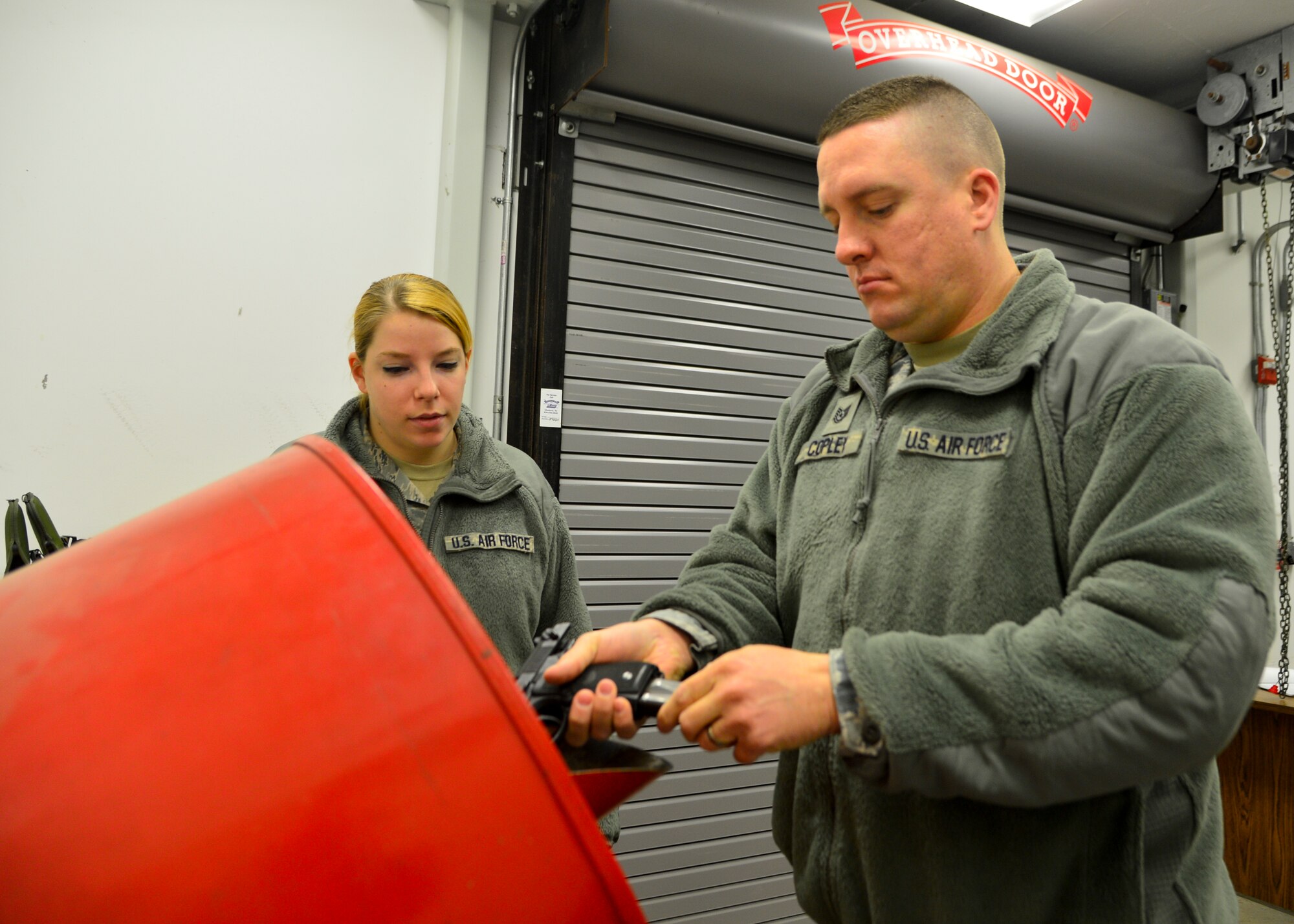 Tech. Sgt. Matt Copley, 436th Logistics Readiness Squadron fuels service center NCO in charge and unit marshal, loads his M9 pistol prior to the start of the duty day Feb. 1, 2016, at Dover Air Force Base, Del. Copley completed the first Unit Marshal Program training class at Dover AFB and is authorized to carry a M9 at his work center during duty hours. (U.S. Air Force photo/Senior Airman William Johnson)