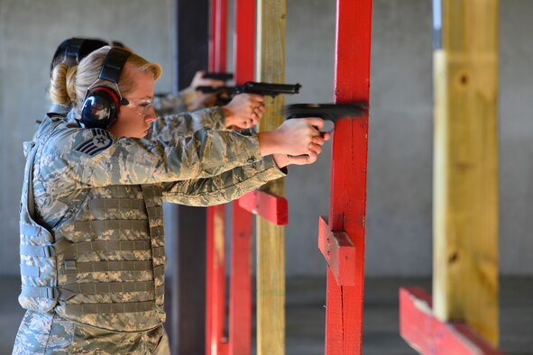 Staff Sgt. Rhonda Russell, 436th Medical Group pharmacy technician, qualifies on aM9 pistol Jan. 6, 2016, at the Combat Arms Training and Maintenance facility on Dover Air Force Base, Del. Russell also shot an advance pistol course to be certified as a unit marshal. (U.S. Air Force photo/Senior Airman William Johnson)