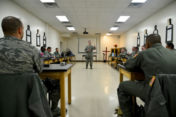 Staff Sgt. Andrew Nadeau, 436thSecurity Forces Squadron combat arms instructor, teaches a weapons fundamentals training course to Airmen Jan. 6, 2016, at the Combat Arms Training and Maintenance facility on Dover Air Force Base, Del. Airmen selected to be unit marshals attended more than 60 hours of training that included classroom exercises and live fire scenarios. (U.S. Air Force photo/Senior Airman William Johnson)