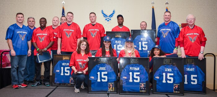 (Left to right) Chief Master Sgt. Mark Bronson, 628th Air Base Wing command chief, Navy Capt. Timothy Sparks, Joint Base Charleston deputy commander, and Col. Rob Lyman, JB Charleston commander, pose for a group photo with the 2015 628th ABW Annual Award Winners Jan. 29, 2016, at the Charleston Club on JB Charleston – Air Base, S.C. The Winners (wearing the red jerseys going from left to right) were PO2 Victor Nyarko (Junior Sailor of the Year) from the 628th Civil Engineer Squadron, PO3 Edward Dingle (Blue Jacket of the Year) from the 628th Force Support Squadron , PO1 Joseph Blacka (Sailor of the Year) from the 628th Security Forces Squadron, Senior Airman Christopher Heflin (Honor Guard Member of the Year) from the 437th Maintenance Squadron, Mrs. Kelly Brainard (Key Spouse of the Year) from the 628th SFS, Capt. Jonathan Blount (CGO of the Year) from the 628th SFS, Mrs. Michaela Judge (Civ Cat II of the Year) from the 628th ABW Public Affairs office, Master Sgt. Travis Heath (First Sergeant of the Year) from the 628th CES, Tech. Sgt. Renae Pittman (NCO of the Year) from the 628th PA office, Mrs. Sheila Reed (Civ Cat I of the Year) from the 628th Comptroller Squadron, Airman 1st Class Leesel Lewis (Airman of the Year) from the 628th CPTS and Mr. Halbert Smart (Volunteer of the Year) from the 628th Medical Group. (U.S. Air Force photo/Senior Airman Clayton Cupit)