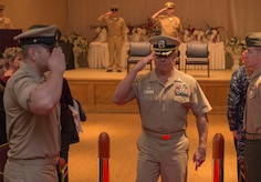 Navy Captain Charles Phillip, Navy Munitions Command Atlanta Unit Charleston commander, salutes as he departs from CWO3 Jason Roach’s commissioning ceremony at the Red Bank Club on Joint Base Charleston – Naval Weapons Station, S.C., on Jan. 29, 2016. Roach was commissioned to CWO3 from MCPO. (U.S. Air Force photo/Airman 1st Class Thomas T. Charlton)