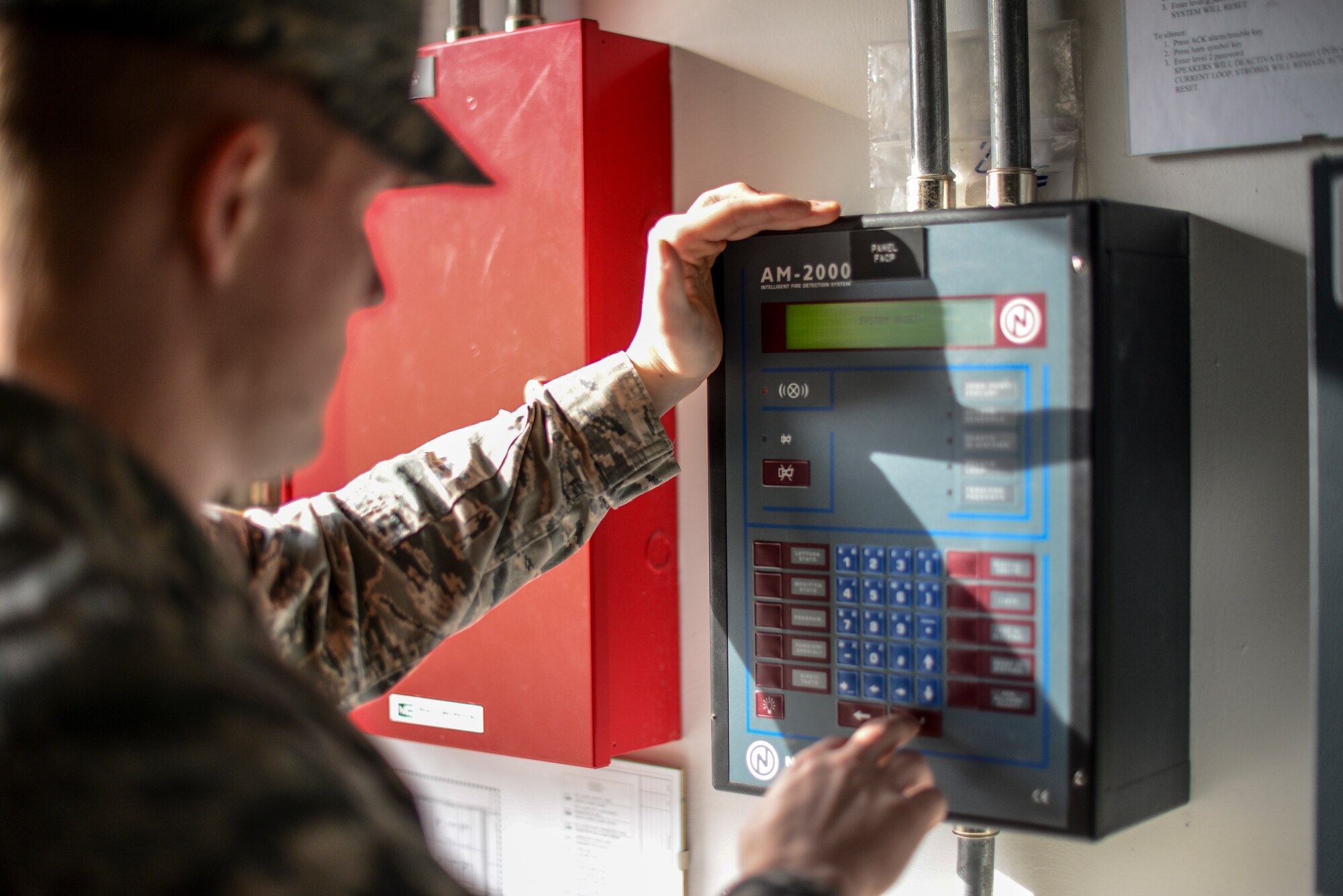 Senior Airman Colton Correll, 31st Civil Engineer Squadron water and fuels systems maintenance journeyman, tests a fire suppression system at Aviano Air Base, Italy, Jan. 26, 2016. The 31st CES uses wet and dry suppression systems to protect infrastructures from fire. (U.S Air Force photo by Airman 1st Class Cory W. Bush/Released)