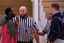 Coaches from the 52nd Logistics Readiness Squadron and 52nd Maintenance Group intramural basketball teams meet with game officials during the second half of the Intramural Basketball Championship game inside the George Price Gymnasium Jan. 28, 2016, at Spangdahlem Air Base, Germany. The 52nd LRS team won the game for the second time in two years. (U.S. Air Force photo by Senior Airman Rusty Frank)
