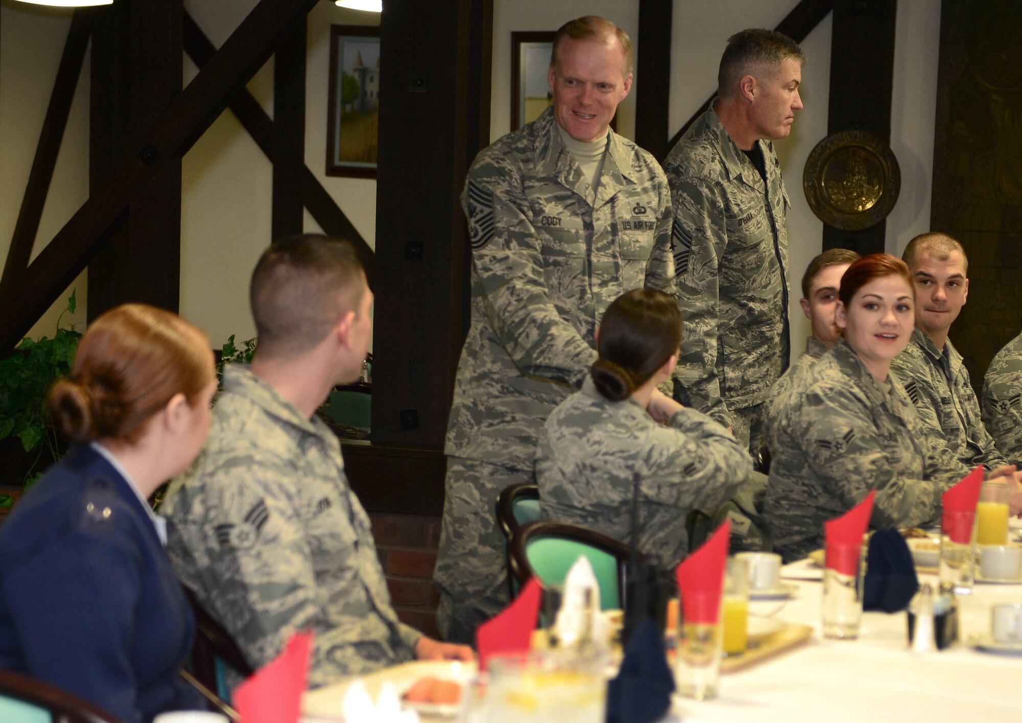 Chief Master Sgt. of the Air Force James Cody greets Airmen during breakfast at Royal Air Force Lakenheath, England, January 28, 2016. He spoke with Airmen throughout the wing and expressed his appreciation for the way the Liberty Wing executes the mission and strives for excellence. (U.S. Air Force photo by Senior Airman Dawn M. Weber/Released)
