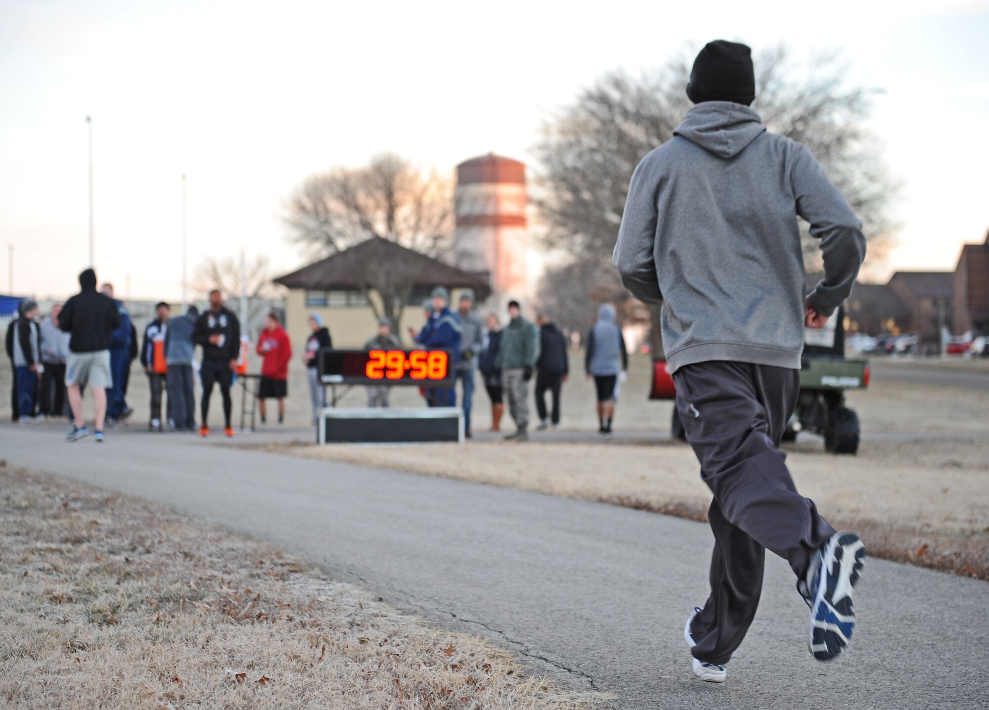A member of Team Whiteman races to the finish line during the Resolution 5k run at Whiteman Air Force Base, Mo., Jan. 29, 2016. The Whiteman 5k is sponsored monthly by the Whiteman Tier II and gives base residents an opportunity to come together as a community, promoting health and fitness. (U.S. Air Force photo by Tech. Sgt. Miguel Lara III)