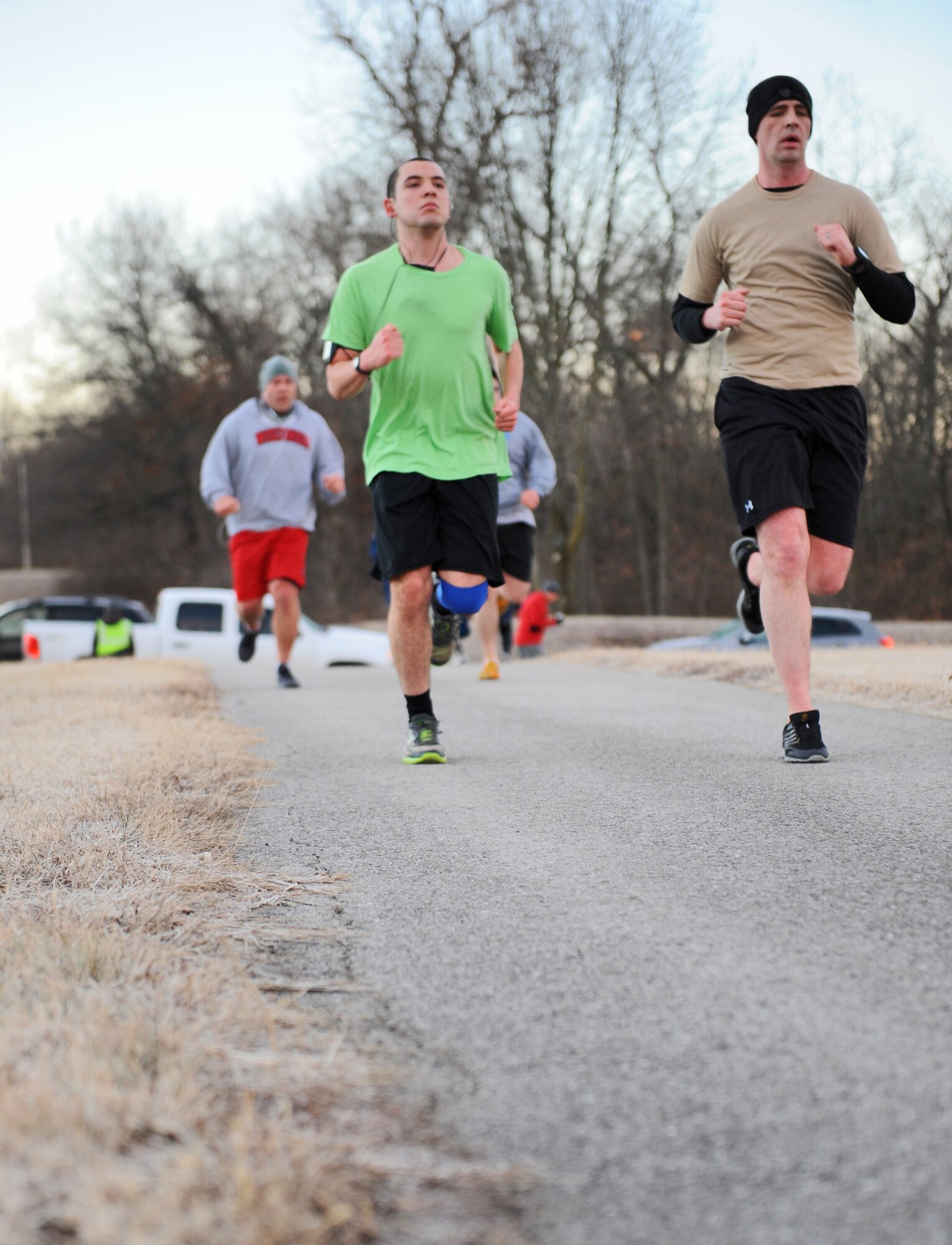 Members of Team Whiteman run toward the finish line during the Resolution 5k run at Whiteman Air Force Base, Mo., Jan. 29, 2016. An information expo was held after the run with representatives from the education office, physical therapy, mental health/ADAPT, the Chaplain Corps, health promotion director and the fitness center staff. The support agencies provided individuals with guidance to help reach their 2016 goal. (U.S. Air Force photo by Tech. Sgt. Miguel Lara III)