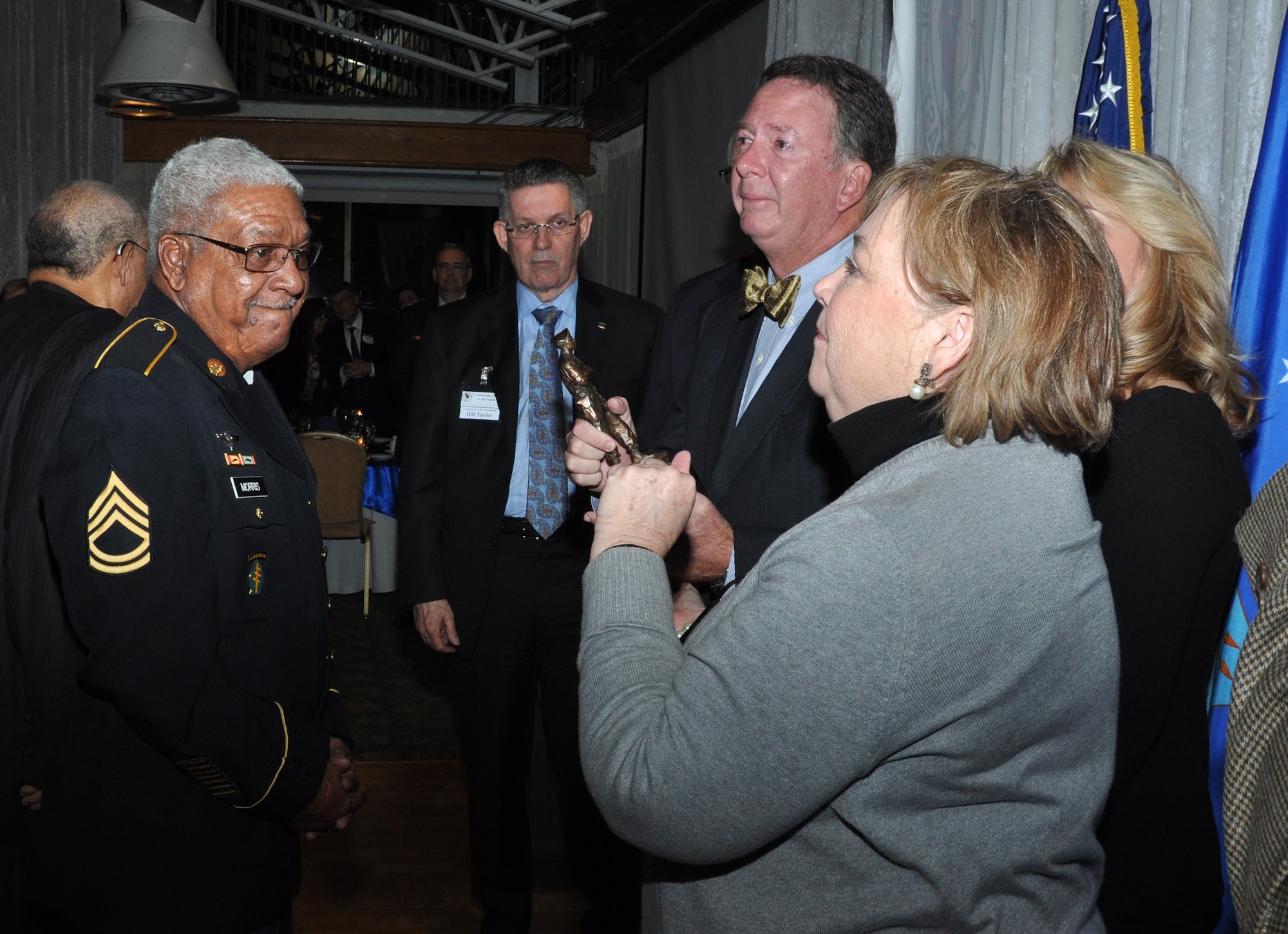 Medal of Honor recipient retired Army Sgt. 1st Class Melvin Morris presents the award named in his honor to the Outlaw family Jan. 21, 2016, at Patrick Air Force Base, Fla. The award recognizes  the Outlaw family’s support of the CivMil Foundation and for providing a lasting legacy on behalf of their father, Beville Outlaw, who displayed a giving and unselfish devotion to his community during his lifetime, according to the CivMil Foundation. (U.S. Air Force photo by 1st Lt. Alicia Premo/Released)
