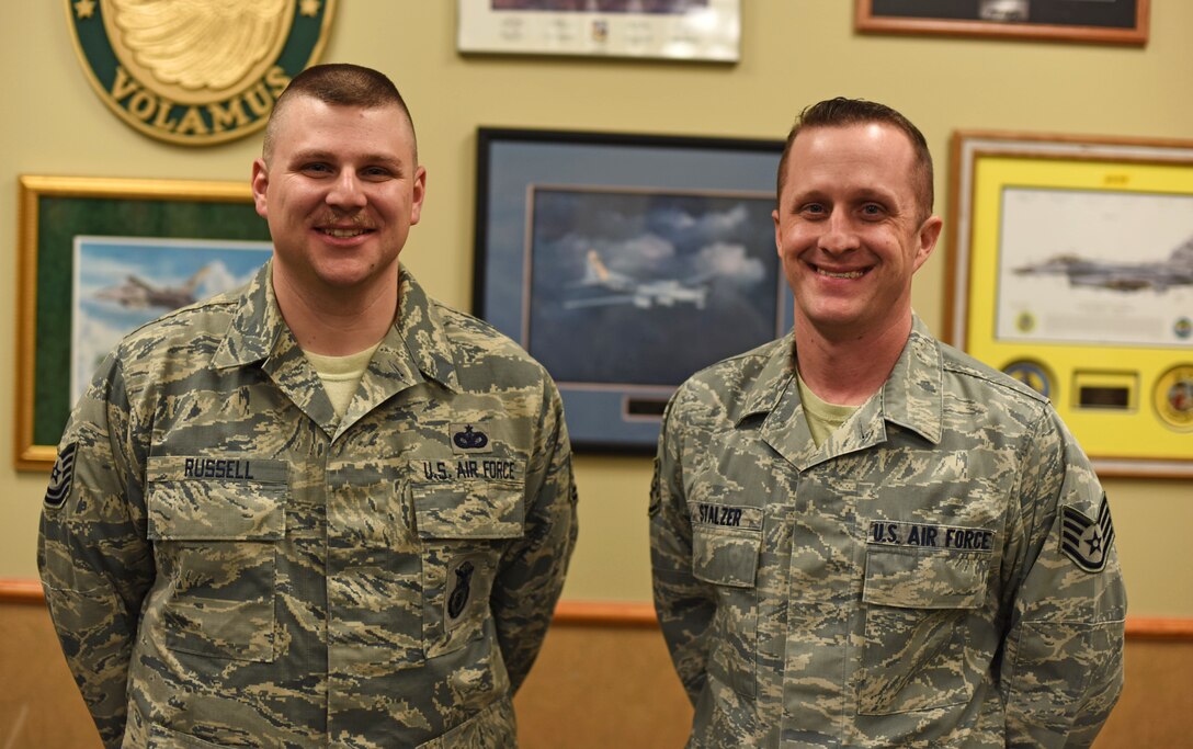 Tech. Sgt. Shaun Russell 341st Security Support Squadron NCO in charge of resources and logistics, left, and Staff Sgt. Joe Stalzer, 819th REDHORSE pavement and equipment apprentice, pose for a photograph after an interview with local media at the Grizzly Bend at Malmstrom Air Force Base, Mont., Jan. 29, 2016. Russell and Stalzer both have a background in first aid and have taken annual military-required CPR training, which they accredit with helping them save a young girl’s life. (U.S. Air Force photo/Airman Collin Schmidt)