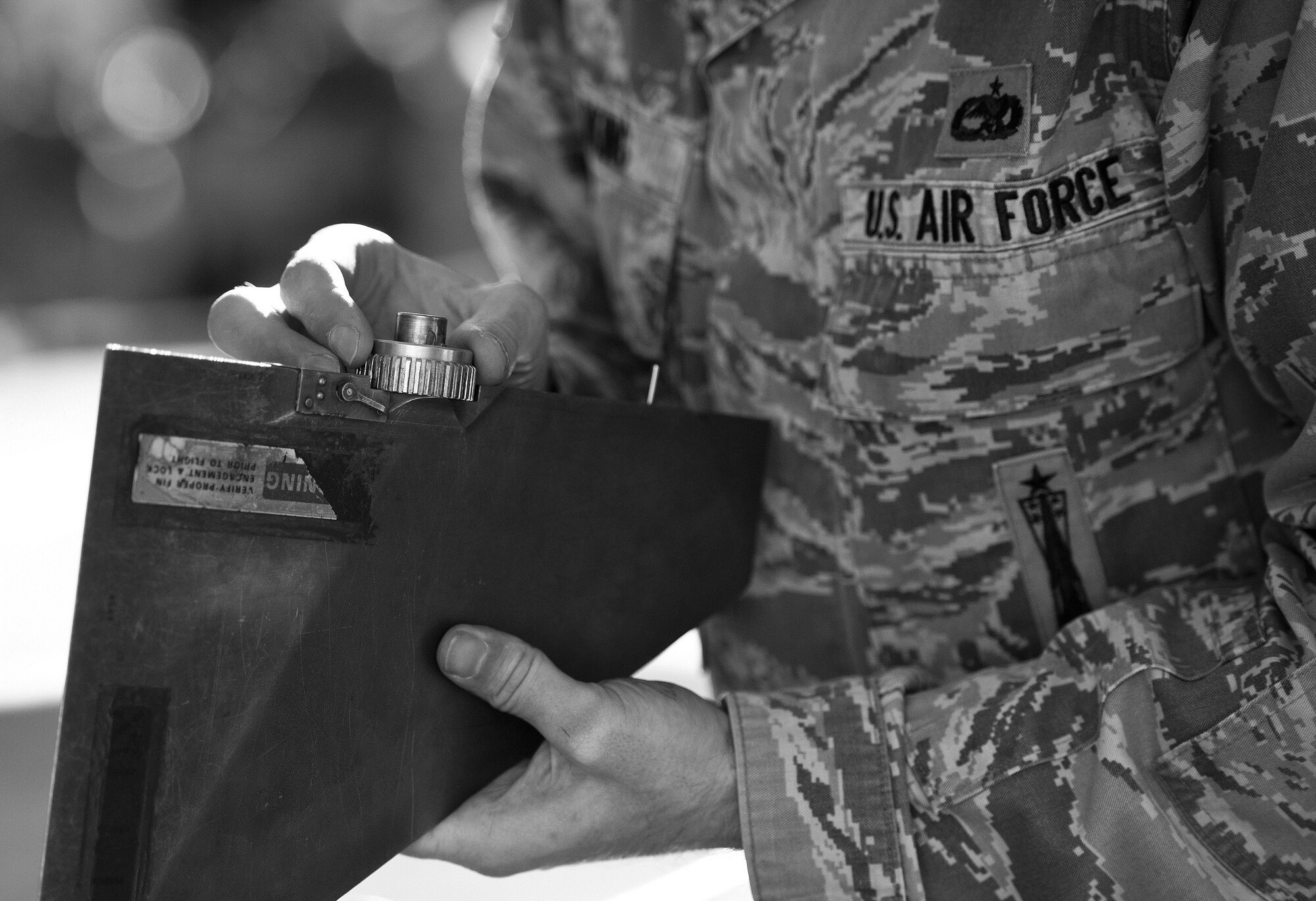 A 96th Aircraft Maintenance Squadron Red team member checks the AIM-9 fins during the Loadcrew of the Year competition at Eglin Air Force Base, Fla., Jan. 29.  Two F-15 Eagle loadcrews battled two F-16 Fighting Falcon loadcrews for the best time and fewest mistakes while loading three missiles to their respective aircraft.  The winners will be revealed at the annual 96th Maintenance Group banquet in March.  (U.S. Air Force photo/Samuel King Jr.)