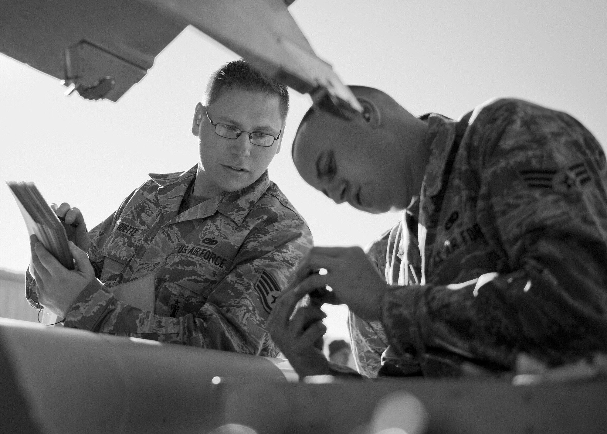 A 96th Aircraft Maintenance Squadron Blue team verifies the parts the weapons during the Loadcrew of the Year competition at Eglin Air Force Base, Fla., Jan. 29.  Two F-16 Fighting Falcon loadcrews battled two F-15 Eagle loadcrews for the best time and fewest mistakes while loading three missiles to their respective aircraft.  The winners will be revealed at the annual 96th Maintenance Group banquet in March.  (U.S. Air Force photo/Samuel King Jr.)