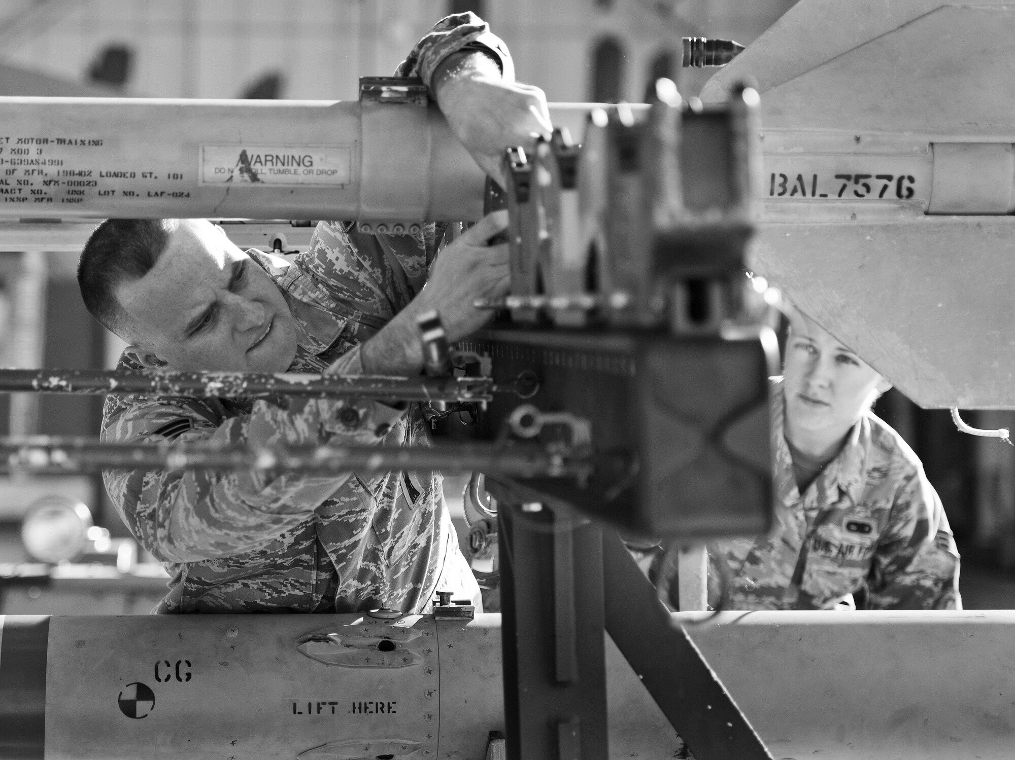 Senior Airman Jonathan Atstupenas, 96th Aircraft Maintenance Squadron Blue, prepares an AIM-120 before moving it to an F-16 Fighting Falcon during the Loadcrew of the Year competition at Eglin Air Force Base, Fla., Jan. 29.  Two F-16 loadcrews battled two F-15 Eagle loadcrews for the best time and fewest mistakes while loading three missiles to their respective aircraft.  The winners will be revealed at the annual 96th Maintenance Group banquet in March.  (U.S. Air Force photo/Samuel King Jr.)