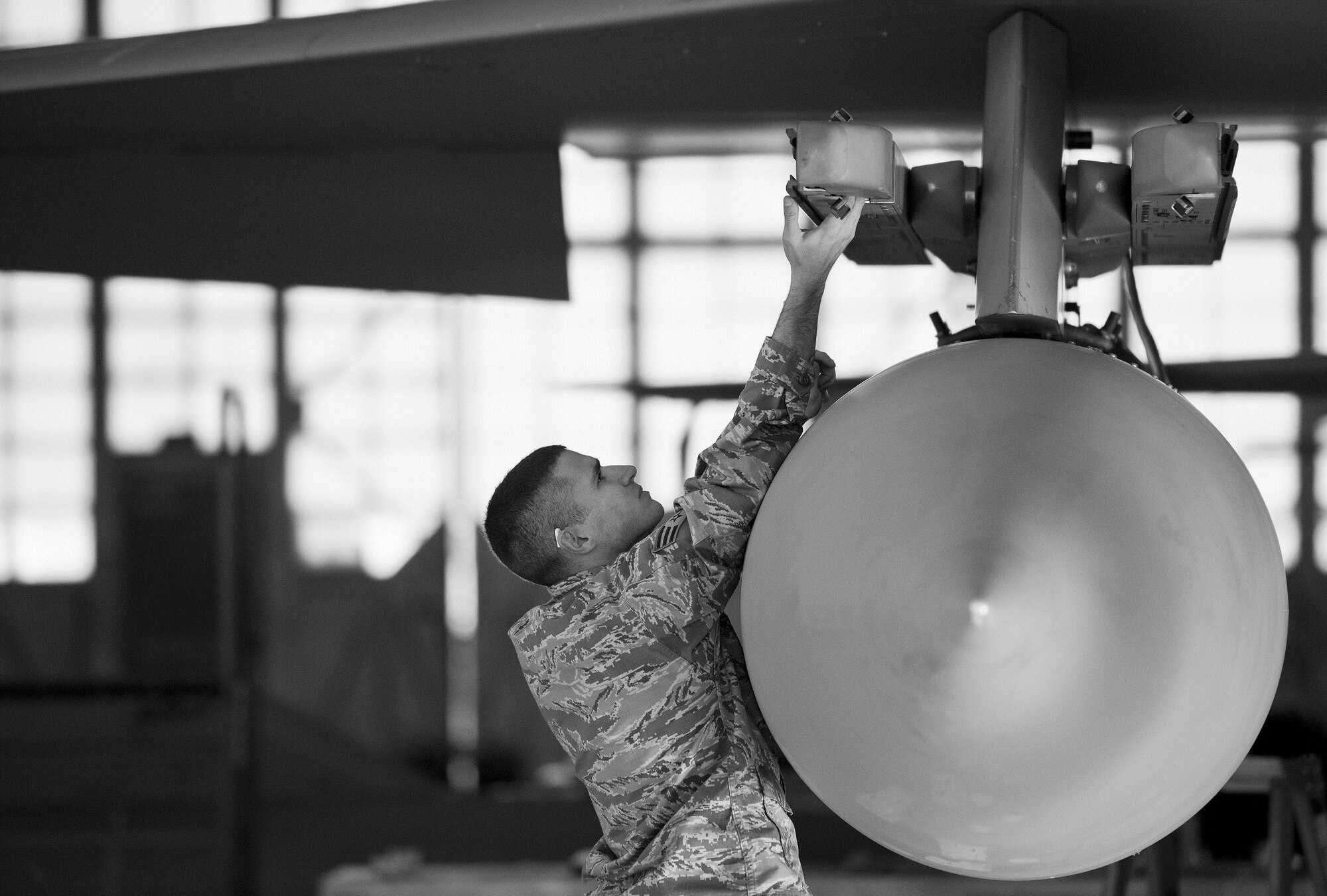Airman 1st Class James Schmeits, 96th Aircraft Maintenance Squadron Red, prepares the F-15 Eagle’s bomb rank for weapons during the Loadcrew of the Year competition at Eglin Air Force Base, Fla., Jan. 29.  Two F-15 loadcrews battled two F-16 Fighting Falcon loadcrews for the best time and fewest mistakes while loading three missiles to their respective aircraft.  The winners will be revealed at the annual 96th Maintenance Group banquet in March.  (U.S. Air Force photo/Samuel King Jr.)