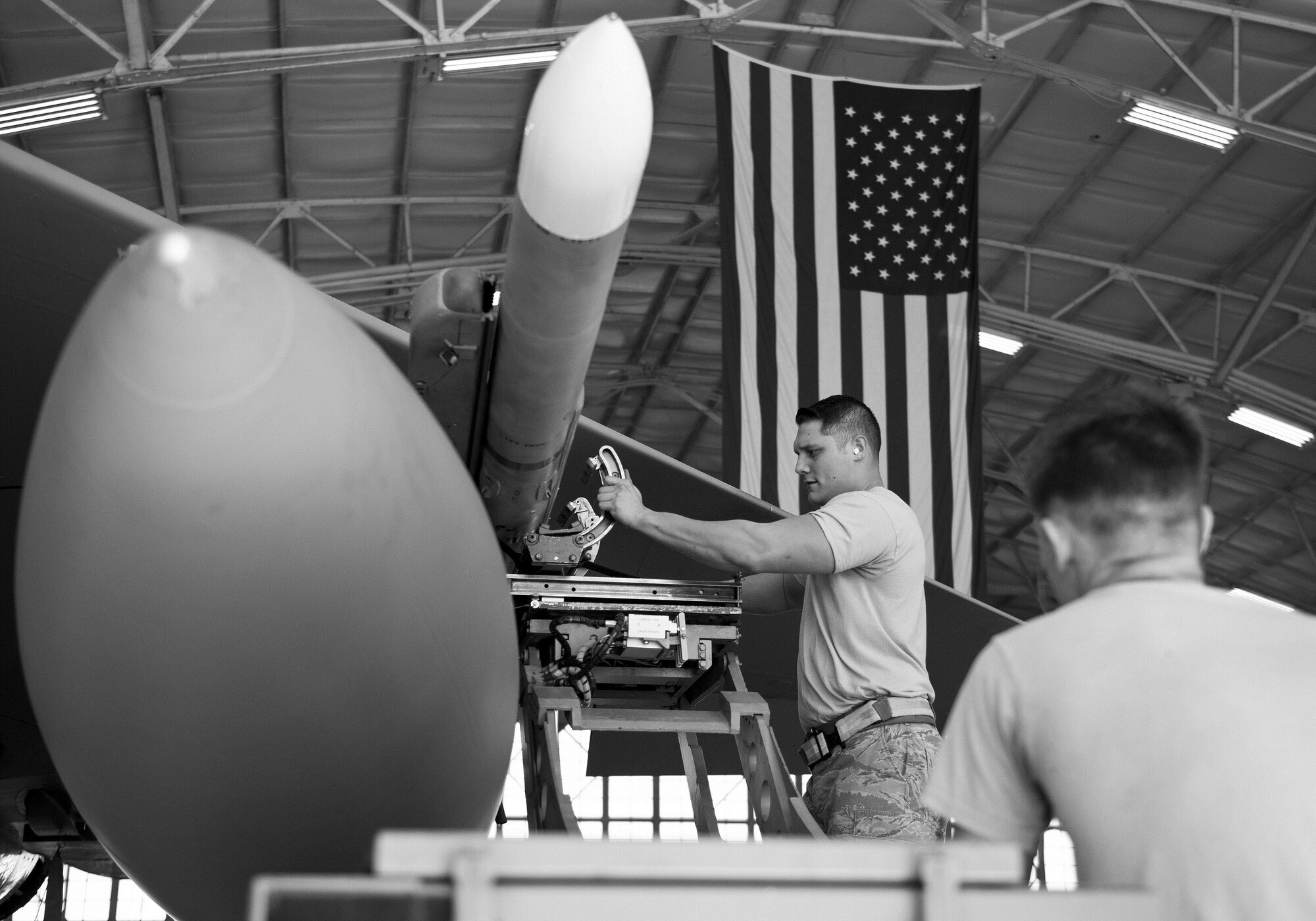 Staff Sgt. Vincent Franco, 96th Aircraft Maintenance Squadron Red, verifies the AIM-120 is in place on the F-15 Eagle during the Loadcrew of the Year competition at Eglin Air Force Base, Fla., Jan. 29.  Two F-15 loadcrews battled two F-16 Fighting Falcon loadcrews for the best time and fewest mistakes while loading three missiles to their respective aircraft.  The winners will be revealed at the annual 96th Maintenance Group banquet in March.  (U.S. Air Force photo/Samuel King Jr.)