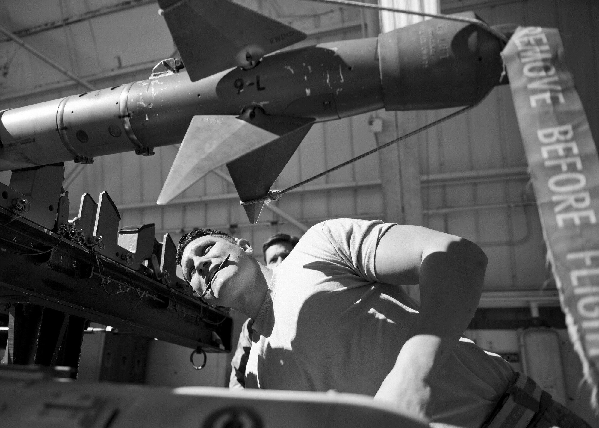 Staff Sgt. Vincent Franco, 96th Aircraft Maintenance Squadron Red, checks out an AIM-9 prior to his team loading it onto an F-15 Eagle during the Loadcrew of the Year competition at Eglin Air Force Base, Fla., Jan. 29.  Two F-15 loadcrews battled two F-16 Fighting Falcon loadcrews for the best time and fewest mistakes while loading three missiles to their respective aircraft.  The winners will be revealed at the annual 96th Maintenance Group banquet in March.  (U.S. Air Force photo/Samuel King Jr.)