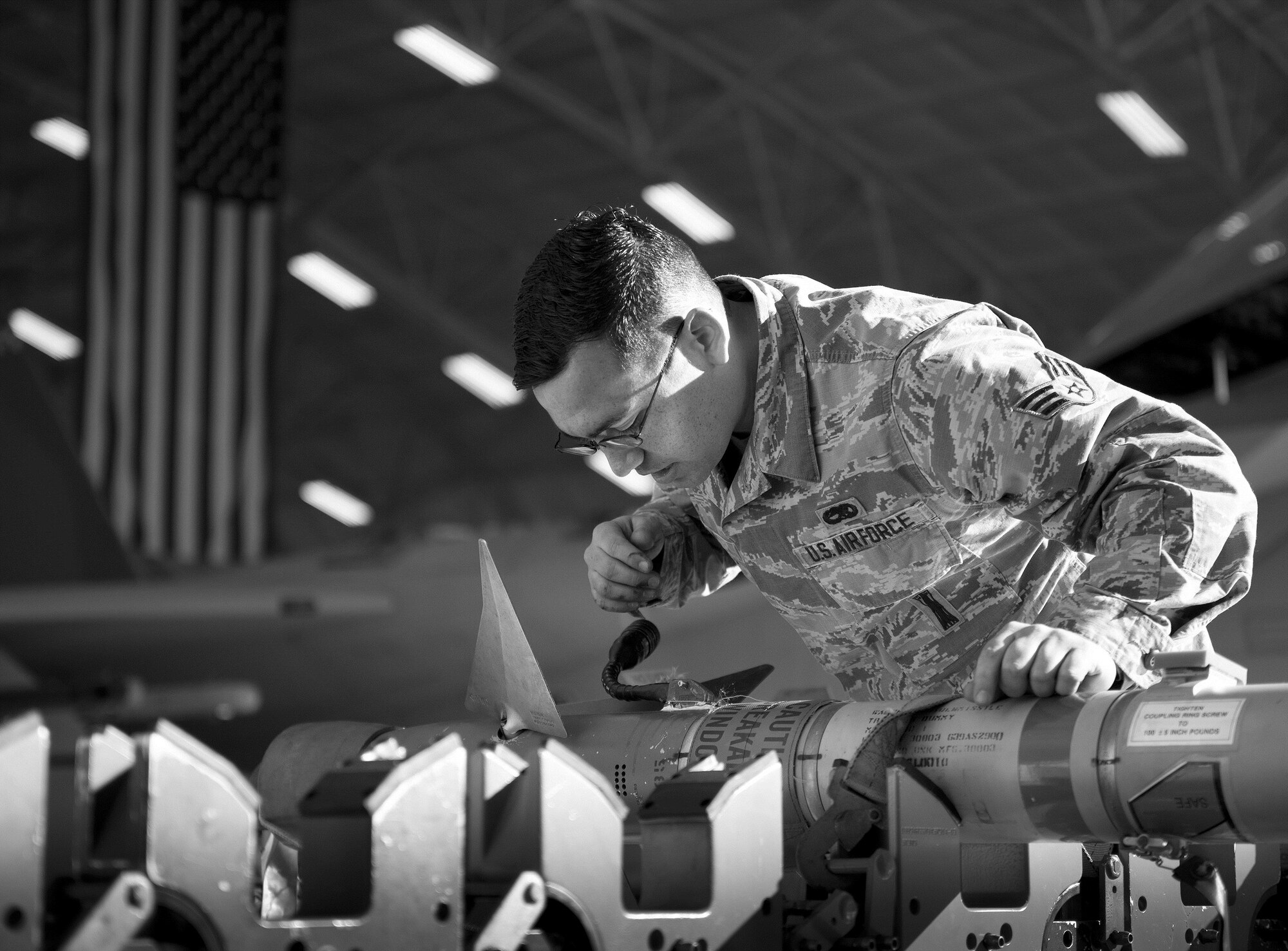 Senior Airman Christopher Mann, 96th Aircraft Maintenance Squadron Red, prepares an AIM-120 prior to moving it to an F-15 Eagle during the Loadcrew of the Year competition at Eglin Air Force Base, Fla., Jan. 29.  Two F-15 loadcrews battled two F-16 Fighting Falcon loadcrews for the best time and fewest mistakes while loading three missiles to their respective aircraft.  The winners will be revealed at the annual 96th Maintenance Group banquet in March.  (U.S. Air Force photo/Samuel King Jr.)