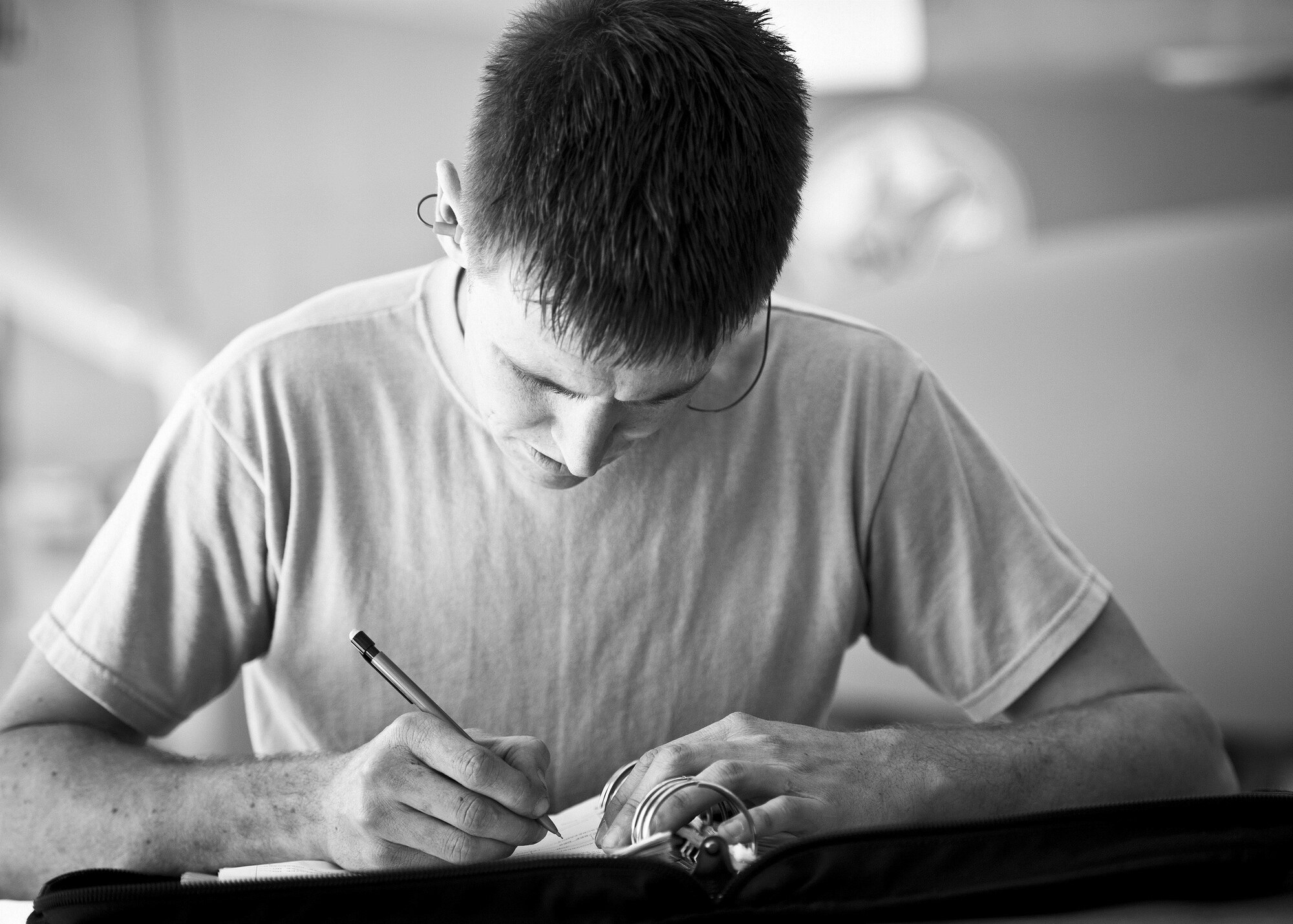 Airman 1st Class William Wakeland, 96th Aircraft Maintenance Squadron Red, completes his F-15 Eaglin post weapon load checklist during the Loadcrew of the Year competition at Eglin Air Force Base, Fla., Jan. 29.  Two F-15 loadcrews battled two F-16 Fighting Falcon loadcrews for the best time and fewest mistakes while loading three missiles to their respective aircraft.  The winners will be revealed at the annual 96th Maintenance Group banquet in March.  (U.S. Air Force photo/Samuel King Jr.)