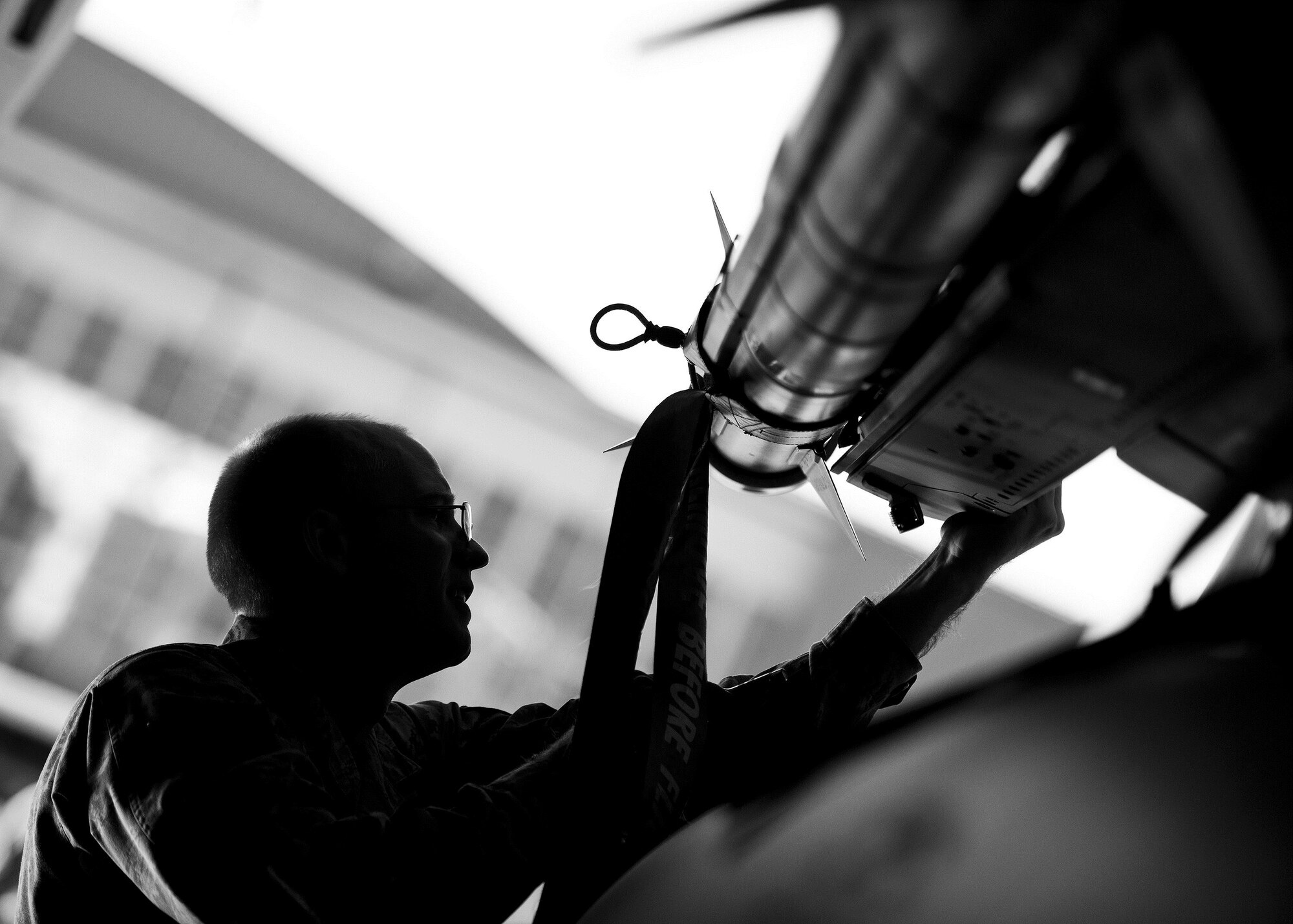 Staff Sgt. Tyler Marking, 96th Aircraft Maintenance Squadron Red, ensures an AIM-120 is properly secured onto an F-15 Eagle during the Loadcrew of the Year competition at Eglin Air Force Base, Fla., Jan. 29.  Two F-15 loadcrews battled two F-16 Fighting Falcon loadcrews for the best time and fewest mistakes while loading three missiles to their respective aircraft.  The winners will be revealed at the annual 96th Maintenance Group banquet in March.  (U.S. Air Force photo/Samuel King Jr.)
