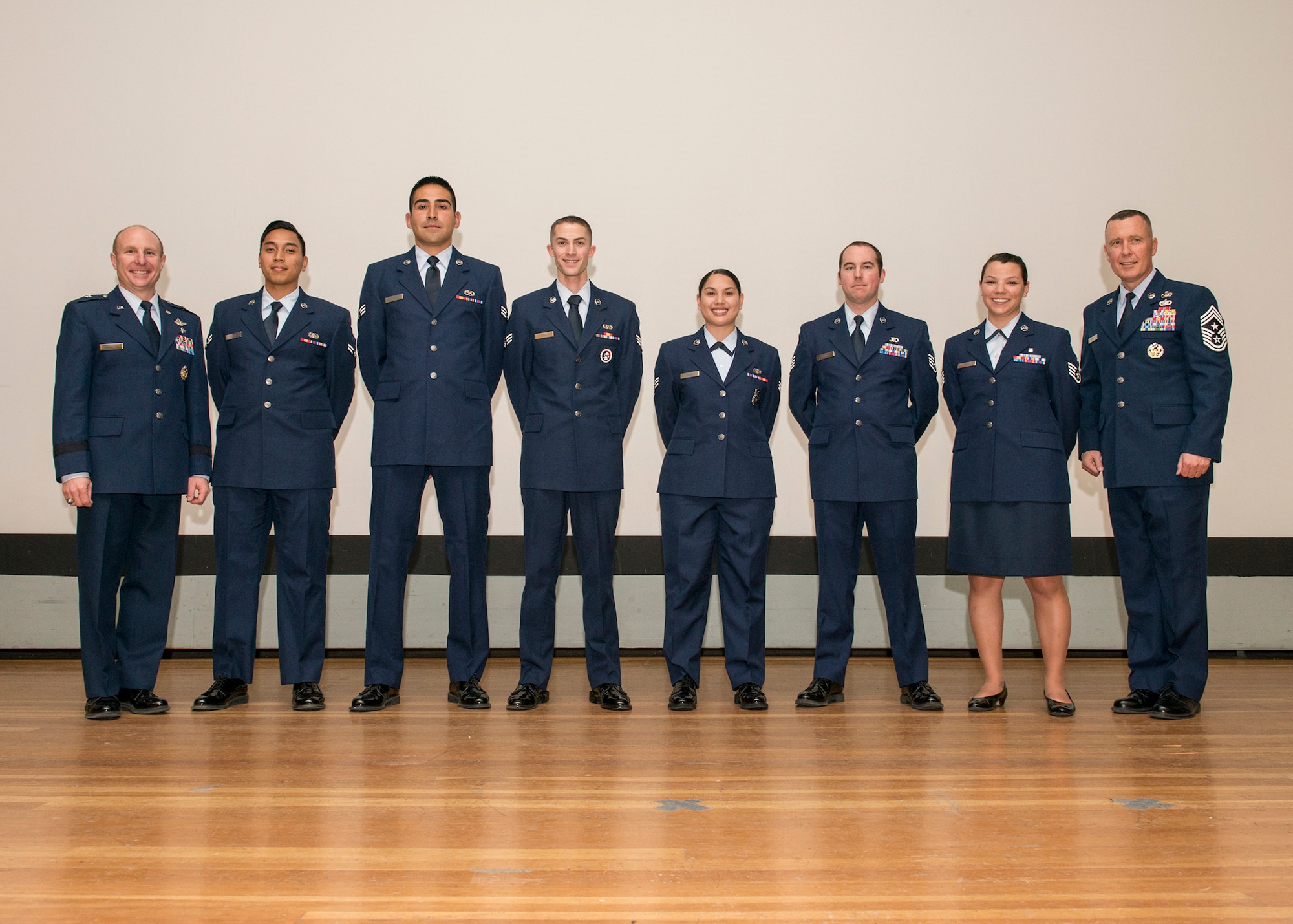 Standing in between Brig. Gen. Carl Schaefer, 412th Test Wing commander (far left), and Chief Master Sgt. David Smith, 412th TW command chief, are some of January 2016's enlisted promotees. The monthly promotion ceremony was held Jan. 29 at the base theater. (U.S. Air Force photo by Edward Cannon)