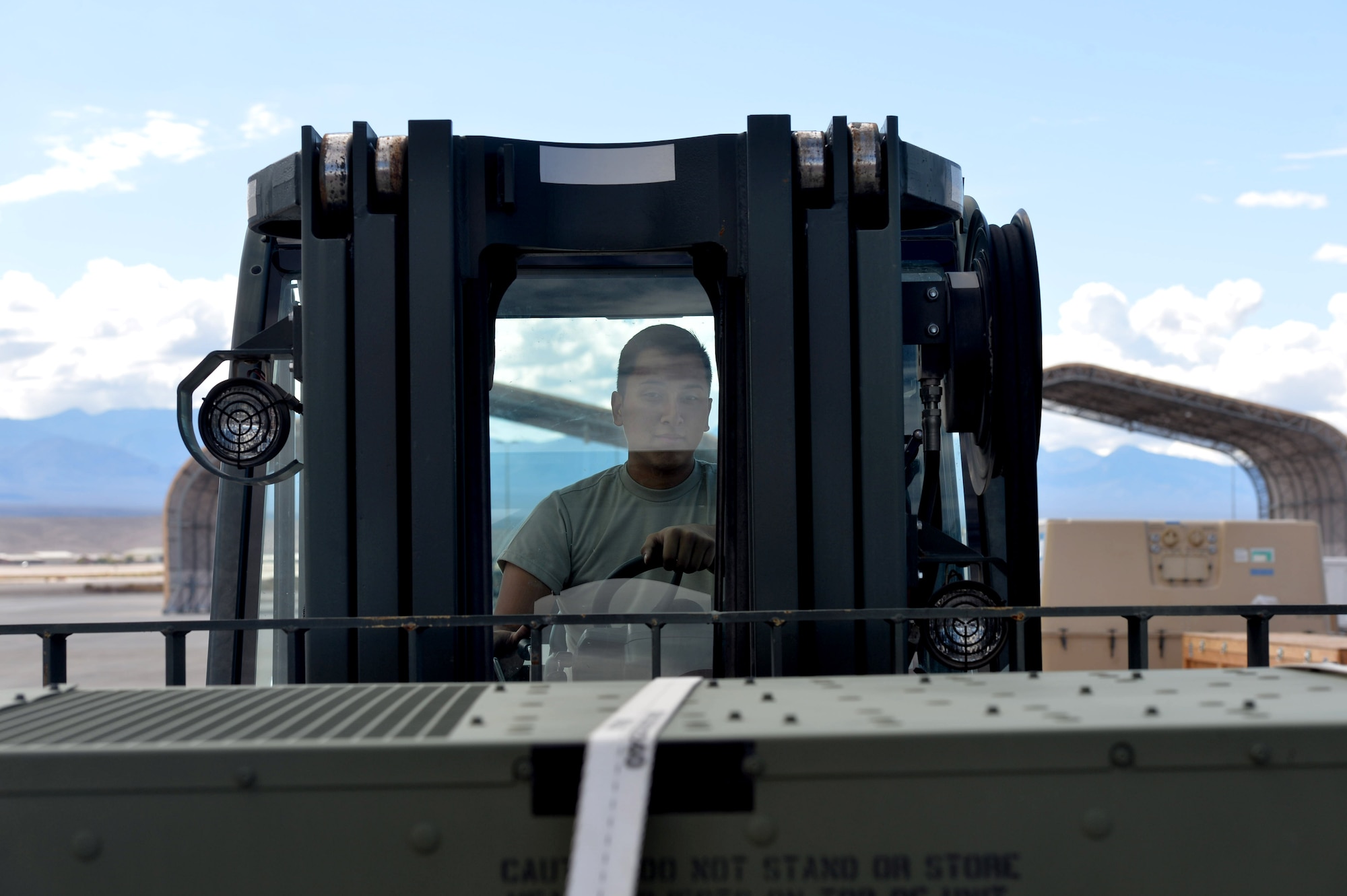 Airman 1st Class Josh, 432nd Maintenance Squadron Aerospace Ground Equipment journeyman, moves equipment to be shipped to a deployment location Oct. 6, 2015, at Creech Air Force Base, Nevada. The 432nd Maintenance Squadron AGE shop supports missions both at home and deployed locations by maintaining ground support equipment. In turn, this equipment is used to maintain remotely piloted aircraft and various other functions that support remotely piloted aircraft. (U.S. Air Force photo by Senior Airman Christian Clausen/Released)