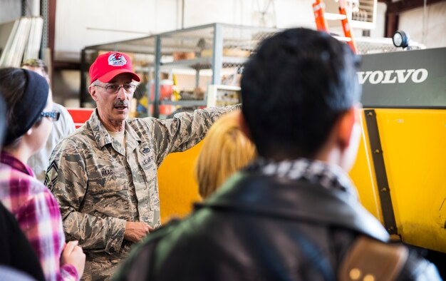 Senior Master Sgt. Robert Haag, rapid engineer deployable heavy operational repair squadron engineer (REDHORSE) training center senior instructor, explains the uses of the asphalt paving machine to students of Northside and Southside public schools about Jan. 25, 2016, during their visit of the 188th Wing at Ebbing Air National Guard Base, Fort Smith Ark. The students are members of the Northside junior reserve officer training corps (JROTC) program and came to the 188th to learn about careers in the Air National Guard. (U.S. Air National Guard photo by Senior Airman Cody Martin/Released)